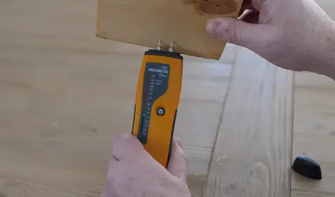 Moisture meter reading on wood during a Dublin, CA dry-out