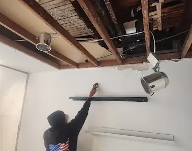 Ceiling opened to the joists after a leak from above in a Dublin, CA home