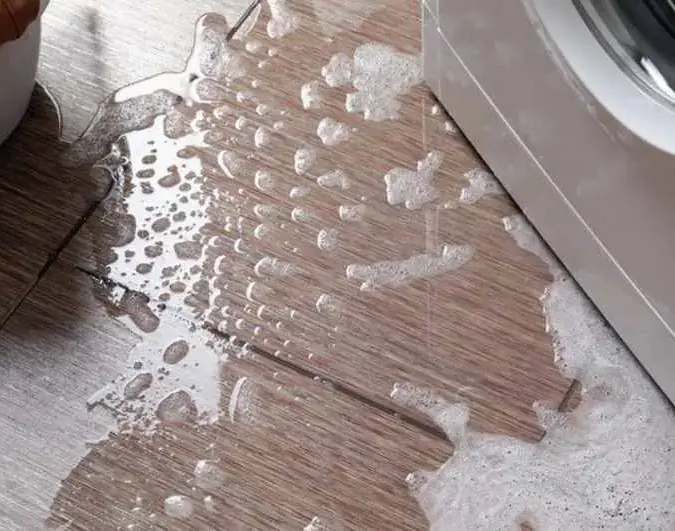 Soapy water spreading across the floor from a leaking washer in Dublin, CA