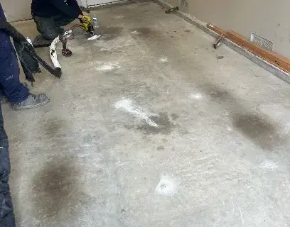 Flooring removed to expose a wet concrete slab after a slab leak in Dublin, CA